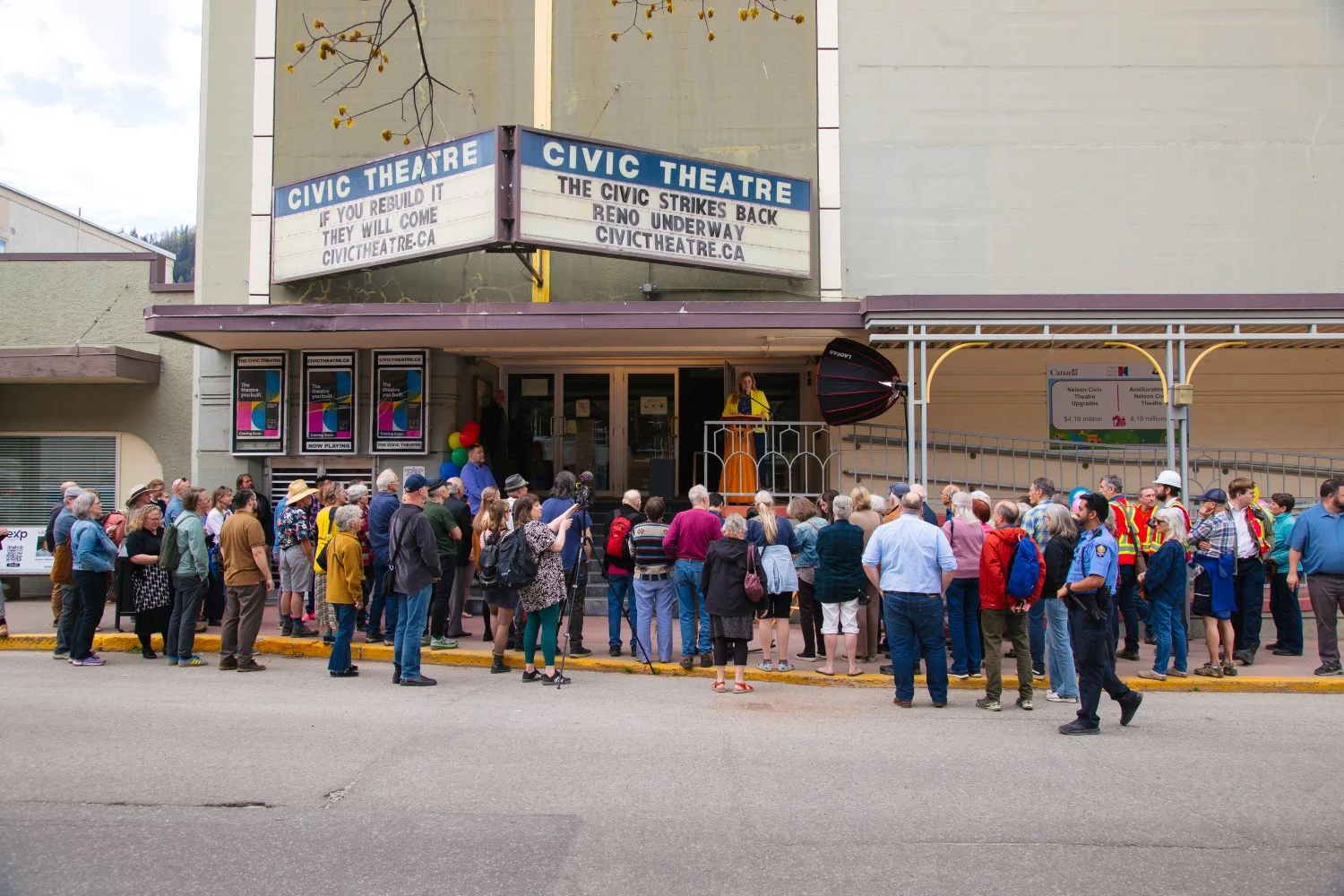 The community gathered beneath the Civic Theatre marquee for the groundbreaking